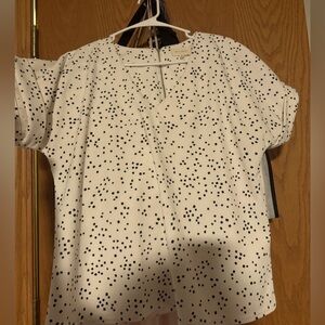 White top with zipper on back, small square pattern, a little bit of stretch